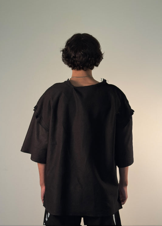 ORIGINAL T-Shirt, Shme-Shno, Hungarian brand, Budapest-founded, handcrafted in Toronto, unisex black oversized shirt, avant-garde fashion, minimalist streetwear, heavyweight premium cotton, sculptural silhouette, raw seams, hand-finished edges, Varrni stitching technique, artisanal craftsmanship, contemporary brutalist aesthetics, cultural heritage meets modern design, limited edition, luxury streetwear, heritage-inspired fashion.

