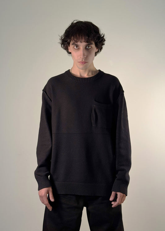 "Black heritage Varga sweater by Hungarian brand Shme-Shno, designed in Budapest by creative director Bence Varga, crafted in Canada using traditional Hungarian Varrni stitching — minimalist pullover combining cultural heritage, modern tailoring, and artisanal craftsmanship."