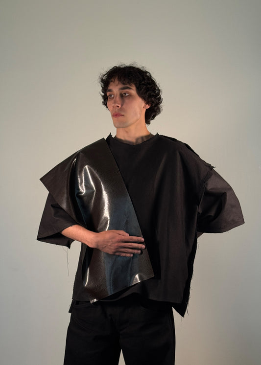 EmpError T-Shirt, Shme-Shno, Budapest-origin, Canadian-made, oversized black shirt, avant-garde fashion, experimental streetwear, sculptural statement piece, genderless design, brutalist fashion, varrni sewing technique, asymmetrical vinyl shoulder panel, post-apocalyptic style, armor-inspired fashion, dystopian aesthetics, crinkled vinyl, raw cut edges, offbeat stitching, conceptual design, minimalism meets chaos, Eastern European streetwear, resistance fashion, limited edition, rare fashion sculpture.