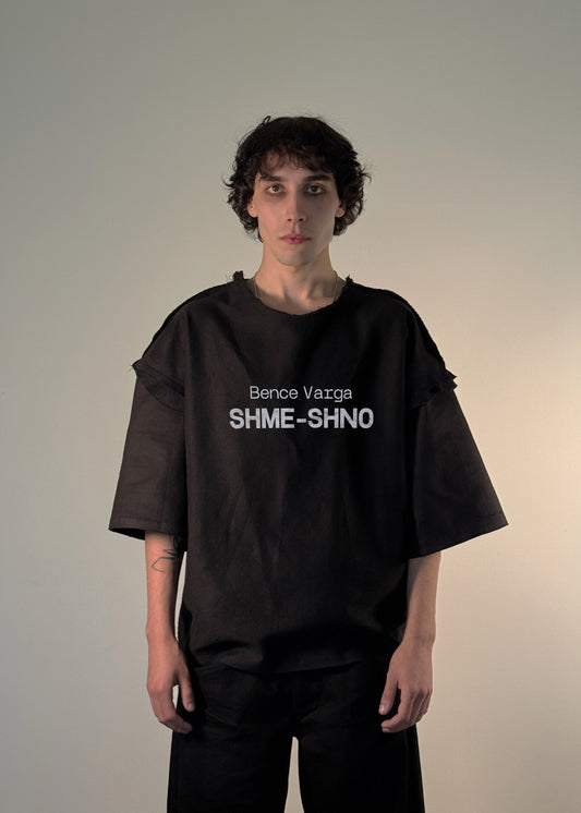 SHME-SHNO T-Shirt, Hungarian brand, Budapest origin, Canadian craftsmanship, varrni hand-sewing technique, Bence Varga collection, heritage fashion, modern design, black oversized t-shirt, luxury streetwear, handmade fashion, artisanal clothing, Budapest to Canada, SHME-SHNO fashion legacy, Hungarian craft, unique fashion piece.
